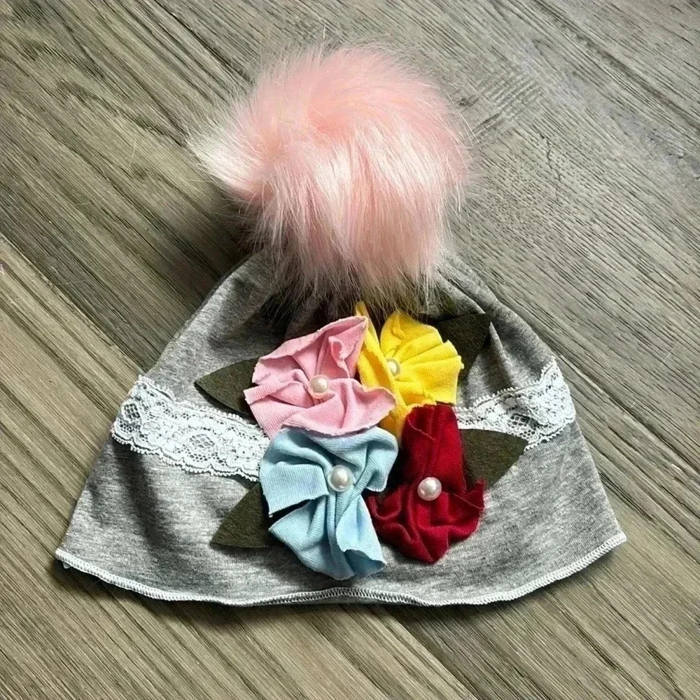Hand crafted grey fall cotton hat with flowers and fuzzy pink pom pom